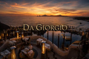 Cliffside terrace of Da Giorgio Cabo in Misiones del Cabo overlooking Land's End at sunset, the legendary Italian restaurant founded by Giorgio Battaglia and Cristina Bremer Rodríguez in 1991