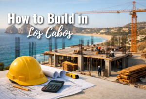 Custom luxury home under construction in Los Cabos showing concrete block walls and ocean view lot representing the risks and process of deciding to build in Los Cabos